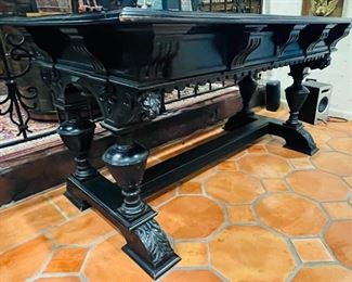 #35 - $595 Continental Ebony carved table   • 31high 58wide 35deep