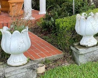#94 - $140 set of two concrete floral urns   • 18high