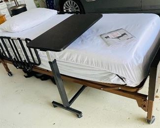 #125 - Hospital bed, almost brand new and tray table 
