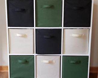 Storage cabinet has fabric baskets