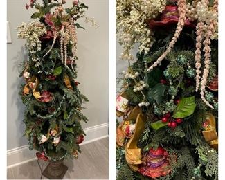 4’7” tall Christmas tree. Decorated in red hats and ‘Santa high heels’