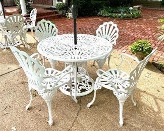 SOLD $450; 2 of these sets available! Set of 7 pieces, 4 wrought iron chairs with wrought iron table and umbrella stand, umbrella included; chairs 23.5w x 21d x 37h; table 41d x 28h; 8’ umbrella