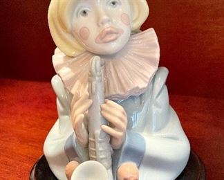 $80; Lladro clown with saxophone on wooden base; 7.5”h