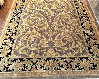SOLD $400; black and gold scrolled rug with fringe:6.5’ x 8.5’; rug #7