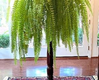 $200; dark wooden plant stand; top 10”d, feet 24”d x 49.5”h