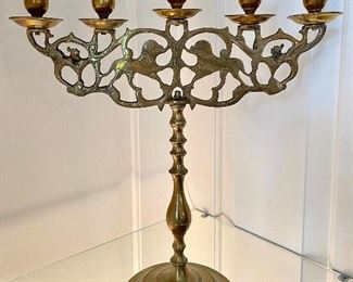 $200; pair of vintage, brass candelabras with intricate carvings; 15”w x 17”h