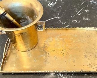 $50; double-handled, solid brass mortar and pestal;    $42; etched, brass serving tray; 13”w x 7”d