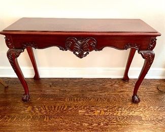 $400; console table with carving and talon feet; 49.5”w x 16.5”d x 31”h