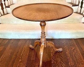 $220; beautiful, walnut pedestal Queen-Anne style tilt-top table with raised edge; 27”d x 28”h