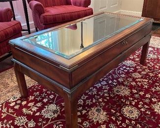 $250; glass top 3-D display area coffee table; 48”w x 23.5”d x 19.75”h