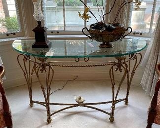 $550, demilune glass top table with gold base. It's a glamorous piece! Lighting was hard to get a good pic in its current space. 