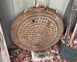 Vintage manhole cover - as salvaged from the dump in the 1970's 