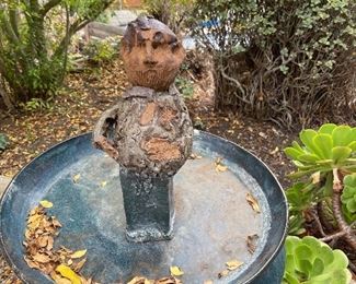 Fabulous pottery man standing in bird bath by Keith Stephens