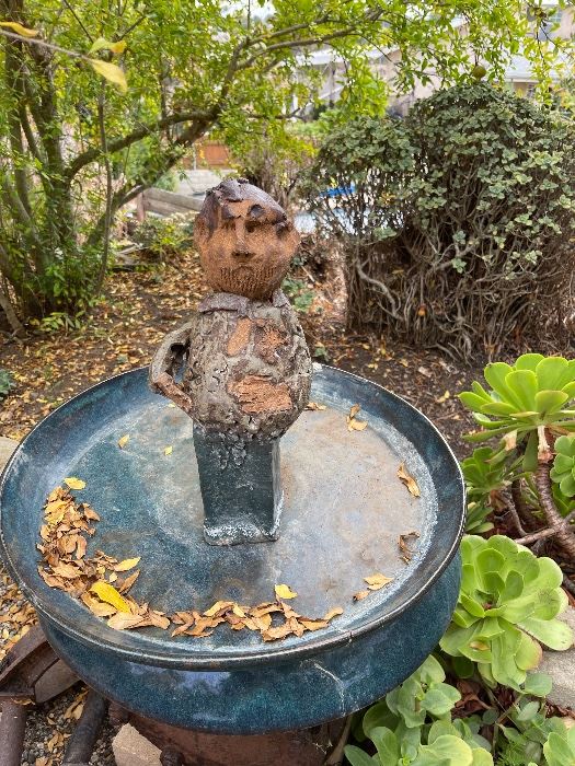 Fabulous pottery man standing in bird bath by Keith Stephens