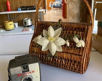 Small wicker purse and vintage camera