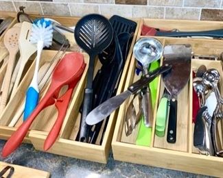 many kitchen utensils including a Cutco serrated spatula