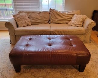 Leather tufted ottoman measures 18" high x 49" wide x 29" deep. Two cushion couch measures 30" high x 92 wide x 42" deep