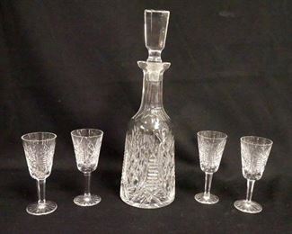 1014	WATERFORD CRYSTAL 5 PIECE WHISKEY SET. THERE IS A SMALL BUMP ON THE SHANK OF THE STOPPER, DECANTER IS 13 3/4 IN HIGH, STEMS ARE 5 1/4 IN HIGH
