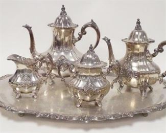 1015	TOWLE 5 PIECE SILVER PLATED TEASET, EL GRANDE PATTERN, SMALLER POT NEEDS A HINGE PIN, TRAY IS 30 1/4 IN ACROSS THE HANDLES, TALLEST POT IS 11 1/4 IN HIGH
