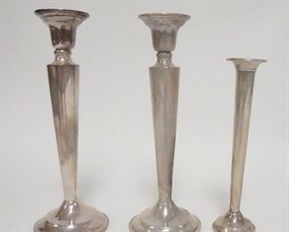 1027	3 PIECE WEIGHTED STERLING SILVER, CANDLESTICKS & BUD VASE, STICKS ARE 7 1/8 IN HIGH
