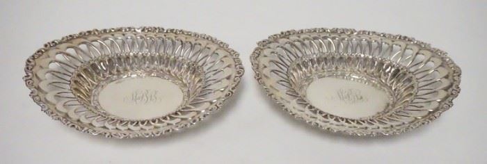 1051	PAIR OF ORNATE STERLING SILVER OVAL BOWLS, MONOGRAMMED, OPEN WORK EDGES, MARKED WITH A WAND RAMPANT LION, 8 1/4 N X 6 1/2 IN, 8.295 TOZ
