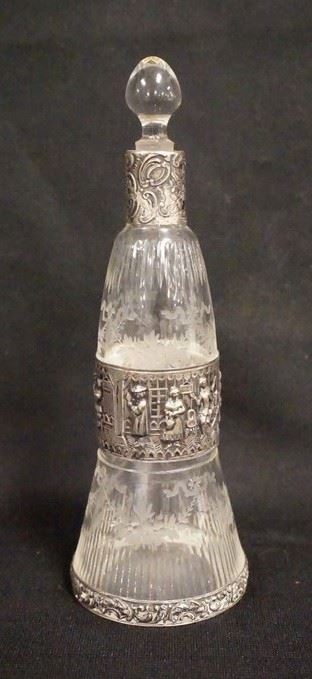 1055	FINELY CUT GORHAM COLOGNE W/SILVER MOUNTS, HALLMARKED, HAS A BAND OF TAVERN SCENES AROUND THE CENTER, 7 1/2 IN HIGH
