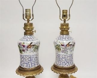 1077	PAIR OF HAND PAINTED PORCELAIN LAMPS, HAVE BEEN ELECTRIFIED, WICK TURNERS MARKED FRANCE, CORDS HAVE BEEN CUT, 29 3/4 IN HIGH

