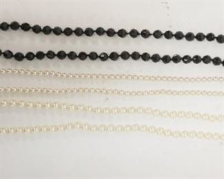 1174	3 NECKLACEACES, JUDITH GREEN BLACK GLASS BEADED NECKLACE 23 IN LONG, CAROLEE SING STRAND PEARLS AND UNMARKED PEARL NECKLACE BOTH 28 IN LONG
