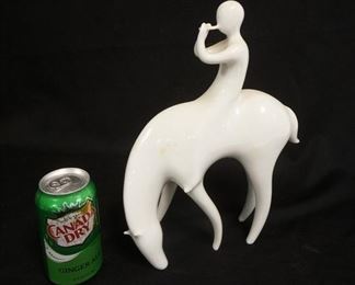 1287	ROYAL DUX MIDCENTURY MODERN FLUTE PLAYER ON HORSE, WHITE PORCELAIN, 9 IN X 12 1/2 IN HIGH
