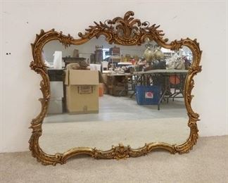 1311	LARGE MIRROR IN ORNATE GILT FRAME, 47 1/2 IN WIDE X 40 IN HIGH
