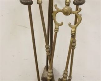 1313	SET OF BRASS FIREPLACE TOOLS IN CAST IRON HOLDER
