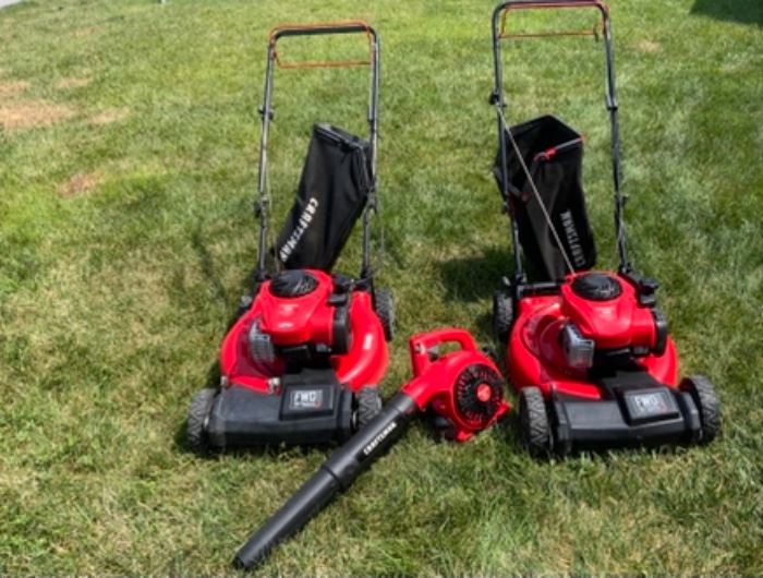 Craftsman Self Propelled His & Hers matching Lawn Mowers. Also shown is a Craftsman new blower.
