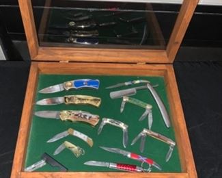 Assortment of knives ranging from collectible to pocket knives