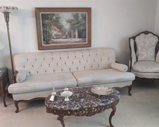 solid sofa and wing chairs