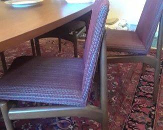 Eight chairs with teak table made of one slab of wood.