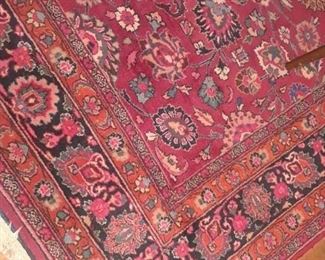 12 x 14 rug in vibrant shades of red and rose.