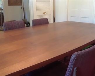 Dining table is custom made of one slab of teak. 87" x 45" wide in center. Tapers slightly at each end.