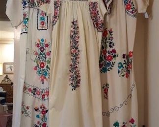 Trio of Mexican dresses. There also are vests and jackets from Guatemala, and men's yukata robes and PJs. Like new, some with tags.