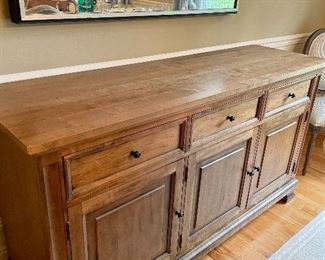 This Ethan Allen Alex Buffet provides ample compartments making this buffet the perfect solution for a gracious dining room. And, other places, too! Three storage drawers and one adjustable shelf behind each door. (20" D x 66" L x 36.5 H")