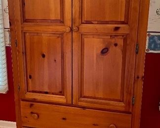 Vaughan Bassett Cottage Pine Armoire, a piece with wonderful style and a great amount of function. There are two doors, 2 drawers, adjustable shelving, 2 open compartments  and the option of nesting a hidden television inside. (38" W x 18" D x 62.5" H)