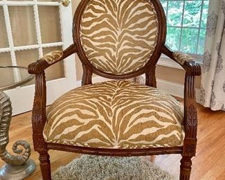 Ethan Allen Francesca Chair in Camel Zebra in almost new condition. This gorgeous Louis XVI style chair features columnar legs, carved rosettes and an oval back.  (40" H x 26" W x 23" D)