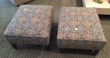 Here you see a pair of matching footstools.