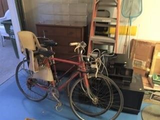 There are two bicycles in this picture.  At least one of them has multiple gear ratios.  This is the garage, which has a lot of items for your perusal.