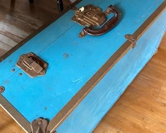 Turquoise vintage trunk filled with embroidery gear including finished towels!