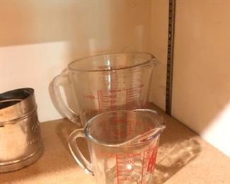 Anchor Hocking 1 cup and 4 cup glass measuring cups $3 ea. ; small Foley flour sifter $2