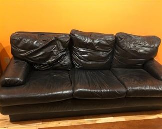 Black leather sofa-some damage from cat scratching $5