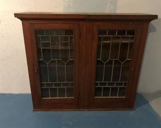 Antique cupboard with stained glass doors 56" wide x 15" deep x 48" tall; one damaged pane of glass $130