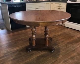 Maple pedestal table with formica top