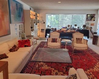 Persian hand knotted Heriz carpet, Mies van der Rohe style Barcelona table, mid-century sectional 