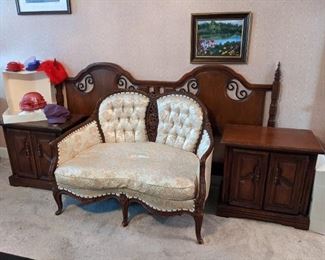 Antique loveseat amidst a King bedroom suite 